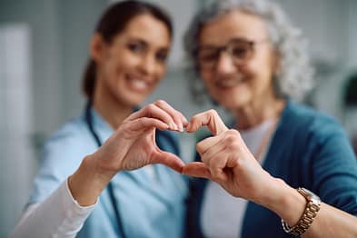 nurse sharing love red heart for health care giving medical help and donation together concept